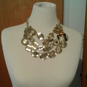NWT.  Gold three layered necklace set